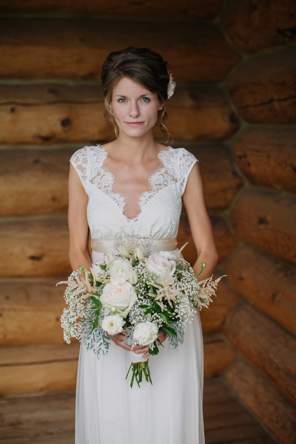 Bride in vintage wedding gown with white and cream bouquet - wedding photo by Michigan-based wedding photographers Bryan and Mae
